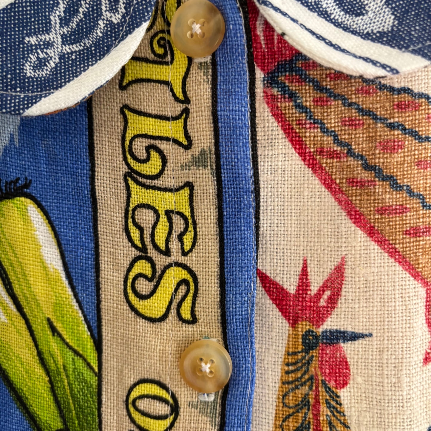 Longer length tea-shirt with pattern and travel destinations.