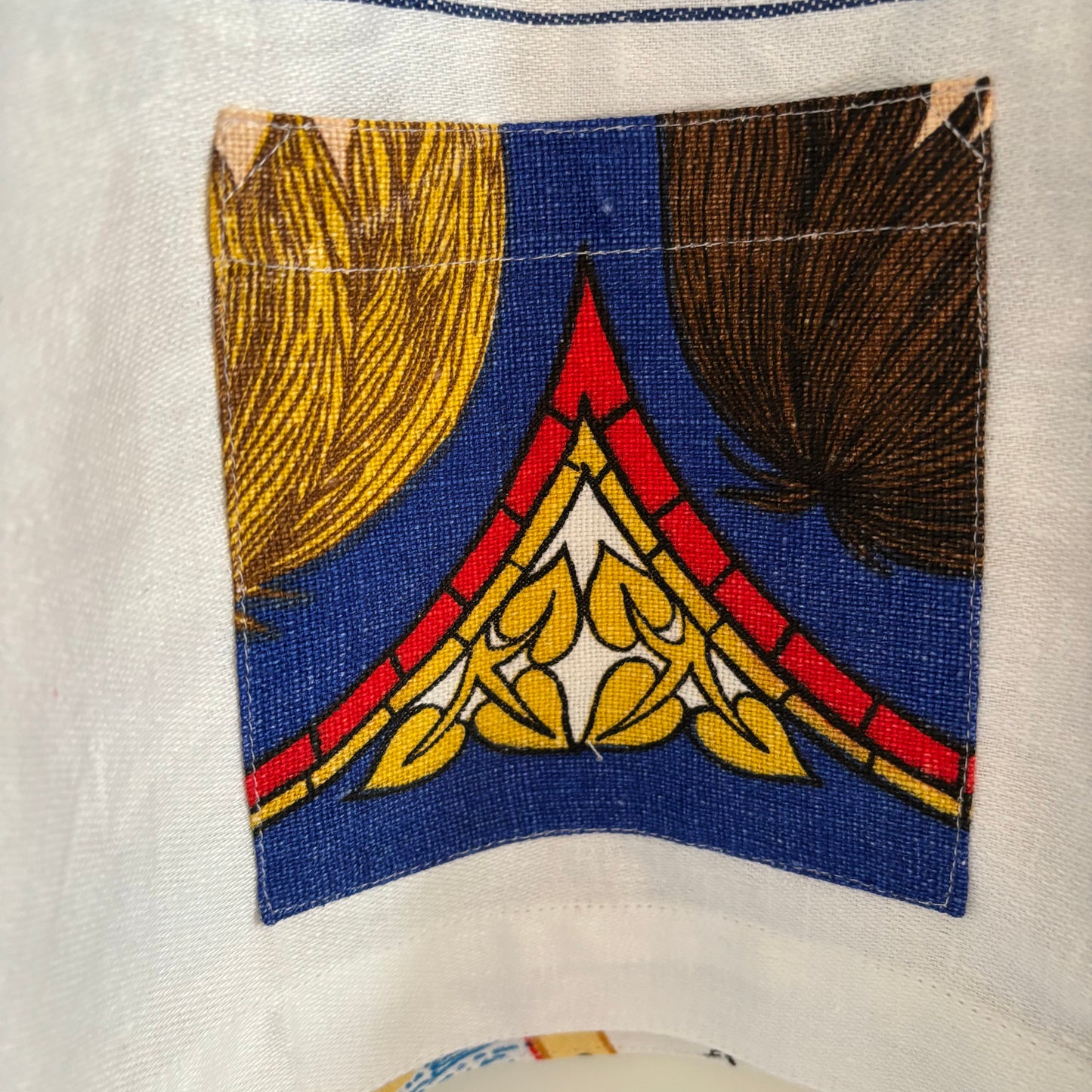 Longer length tea-shirt with pattern and travel destinations.