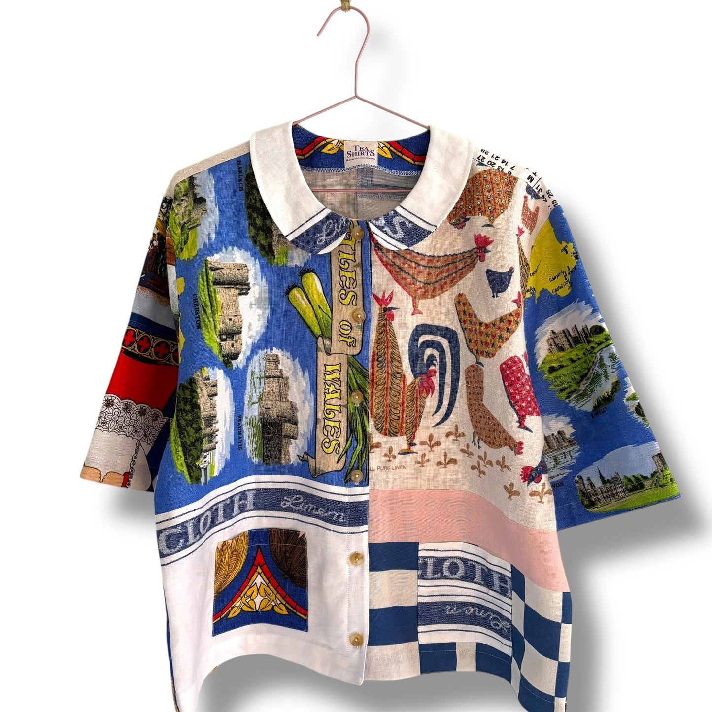 Longer length tea-shirt with pattern and travel destinations.