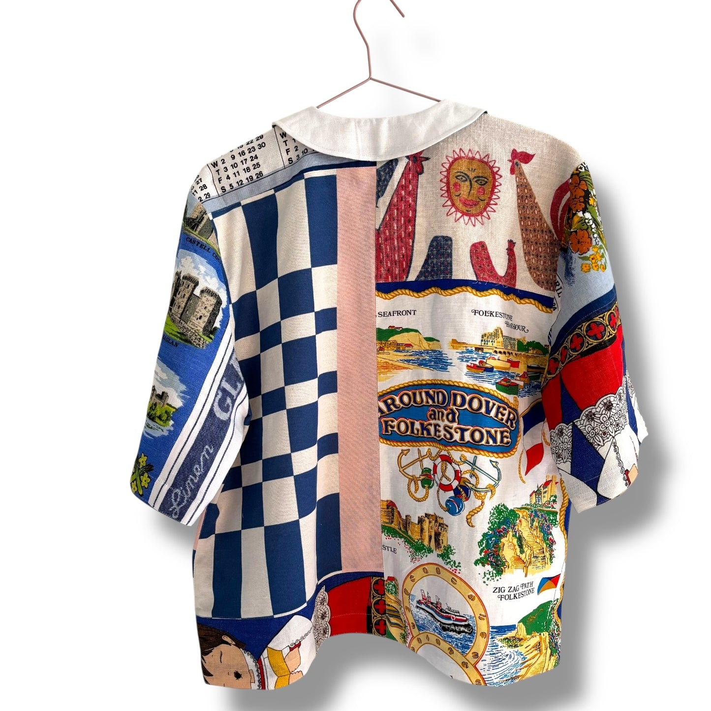 Longer length tea-shirt with pattern and travel destinations.