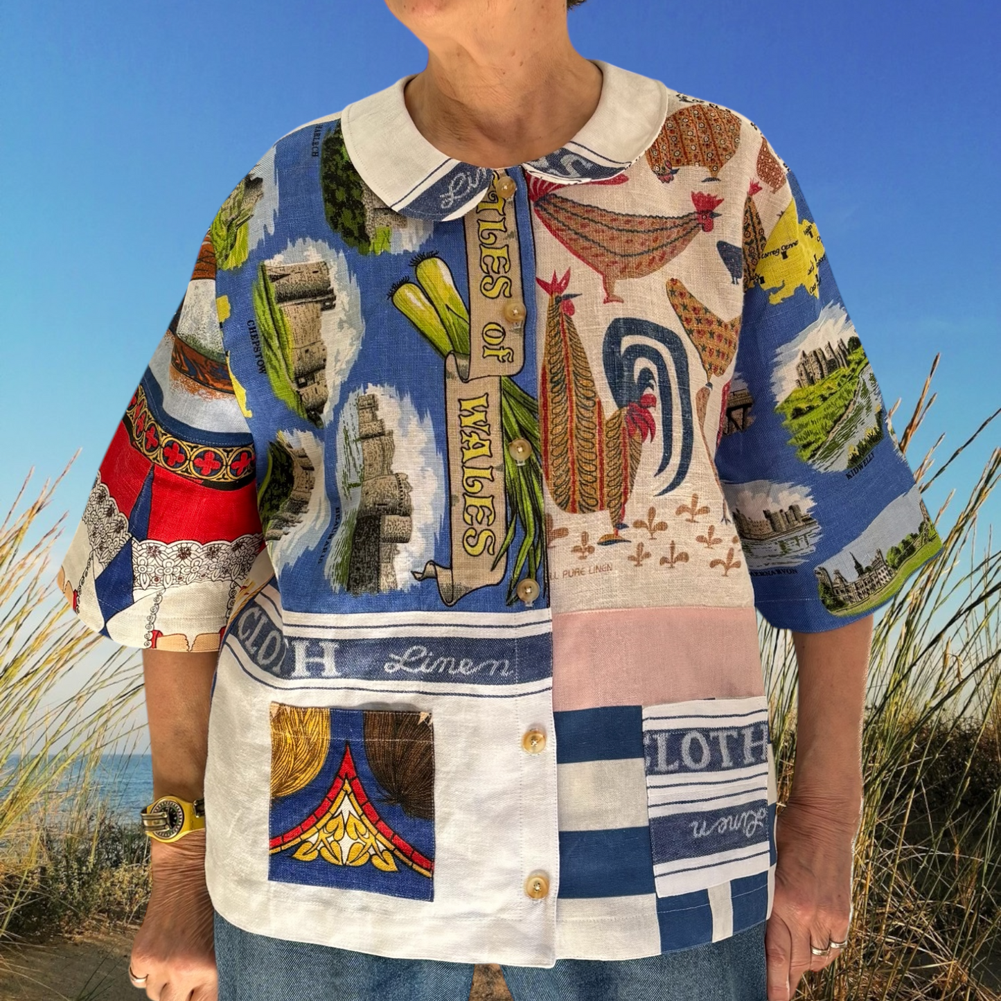 Longer length tea-shirt with pattern and travel destinations.